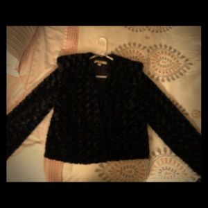 Vintage look jacket. Soft silky black faux fur.